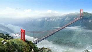 Image of a very long bridge going over a water